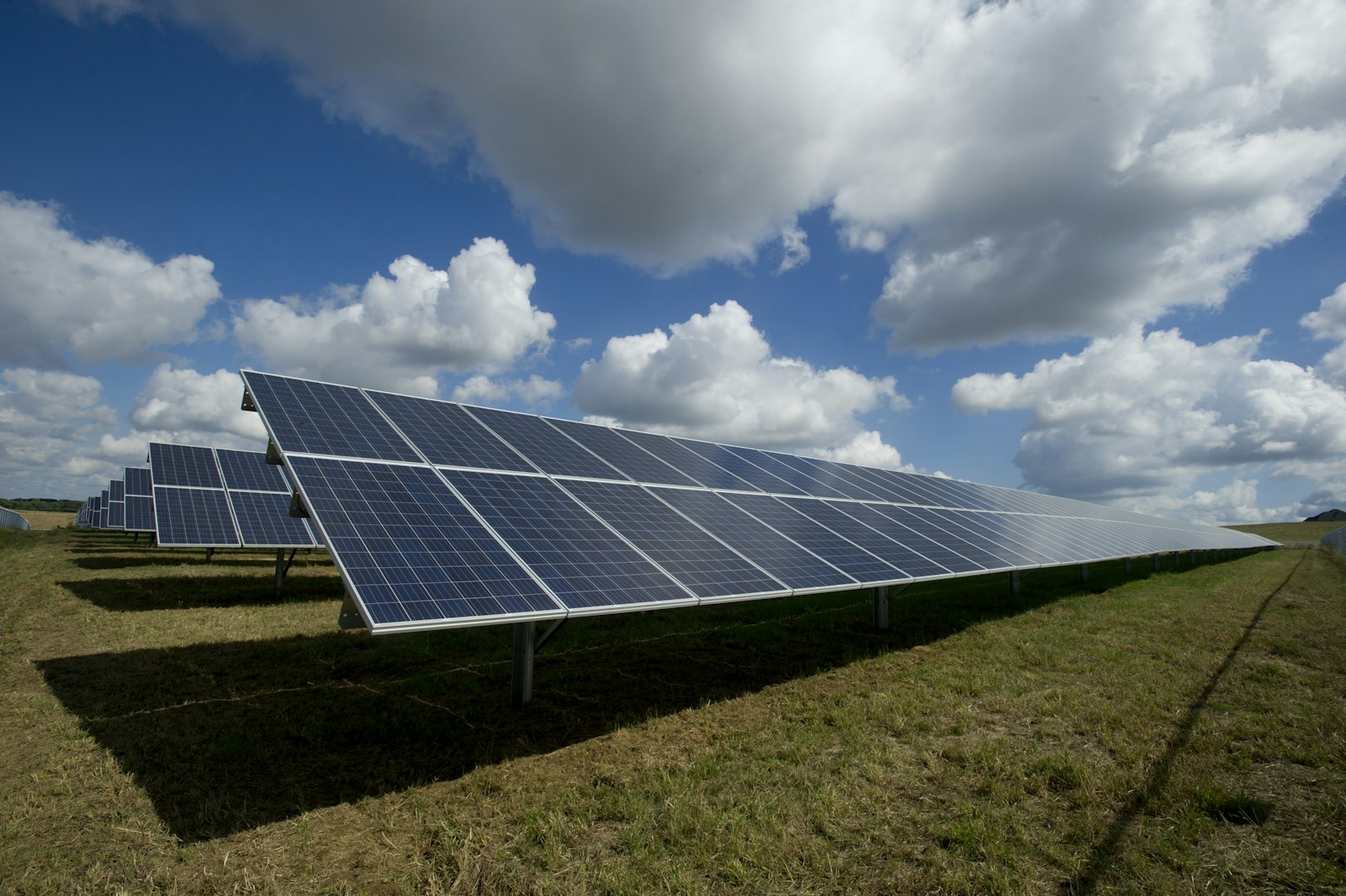 Solar panels at sunrise with the mountain range in the background in inland Spain